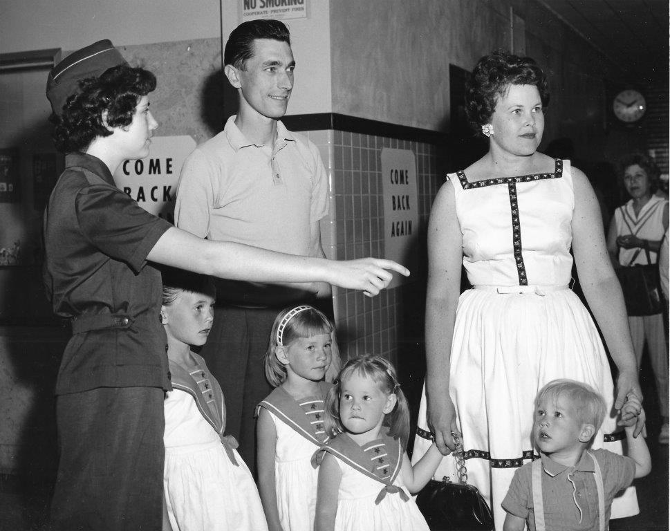 The Regan family is escorted inside to receive their vaccinations.